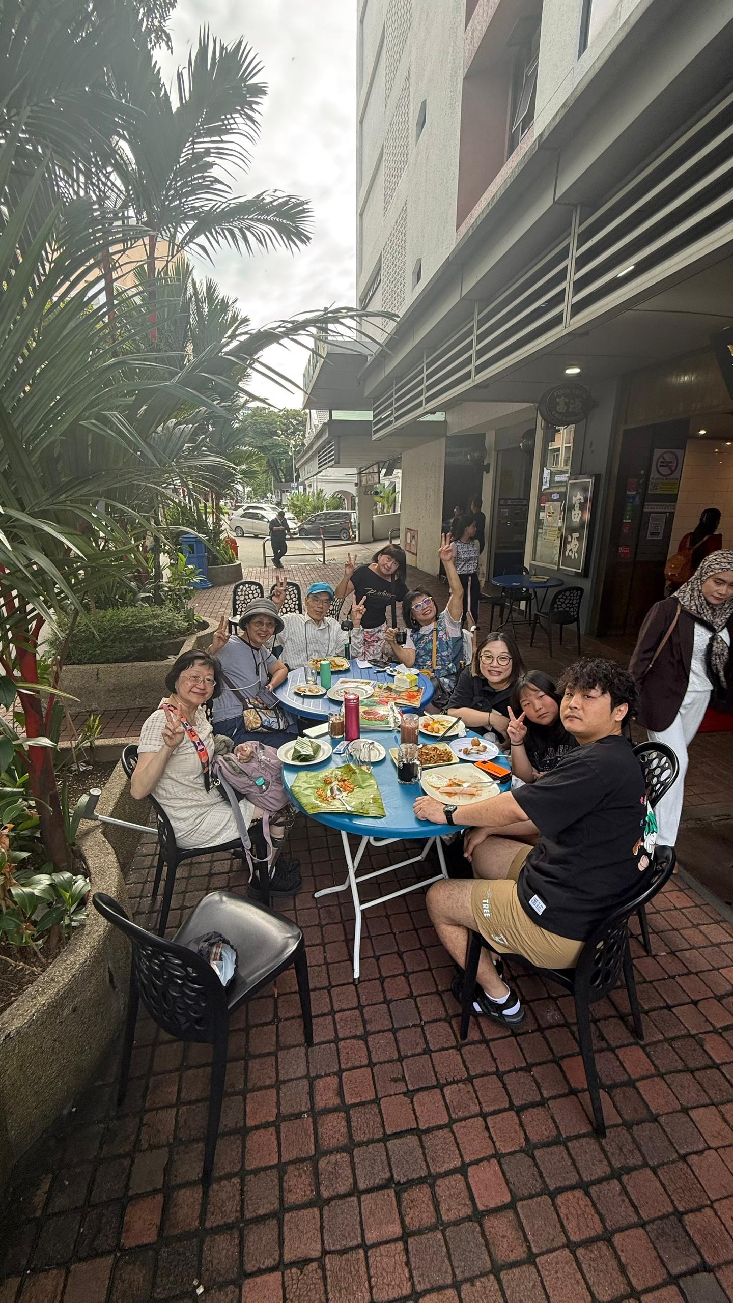 Wheelchair users shopping together at a Sabah wet market